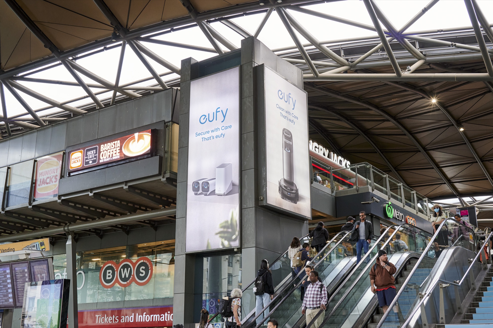 eufy escalator column wrap at Southern Cross Station